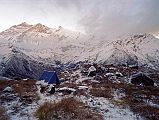 501 Camp On Top Of The World Ridge Returning from Annaurna North Base Camp Sun hit our camp at the first French Annapurna North Base Camp at eight oclock as we were breaking camp. Left at 8:15. We hiked back down to the Miristi Khola, and crossed it again on the log, arriving on the far bank at 10:30. We had an early lunch of Tibetan momos, fried potatoes in curry sauce, and coleslaw. We left the Miristi Khola at 12:15 and climbed up and up, forever up until at 14:30 we reached the first stream, where we set our camp. The weather on arrival was hail and 2C.